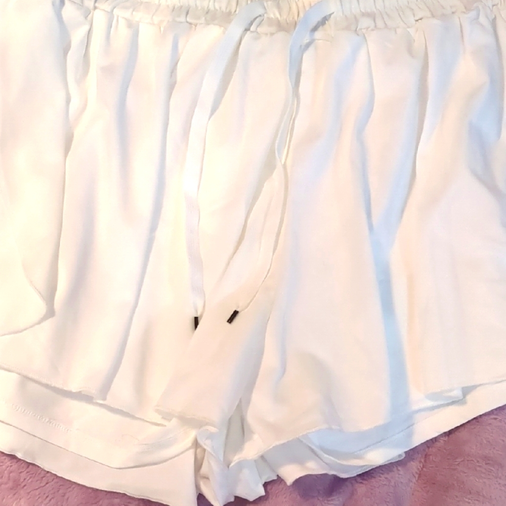 Women's White Shorts. These are skorts. Shorts underneath a mini skirt